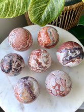 Load image into Gallery viewer, Red Crazy Lace Agate spheres from Mexico